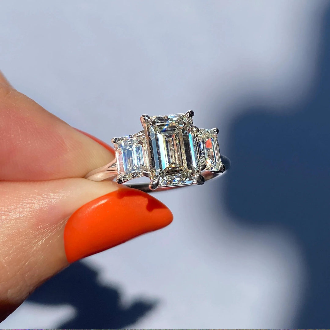 Shop the emerald cut three stone engagement ring collection online