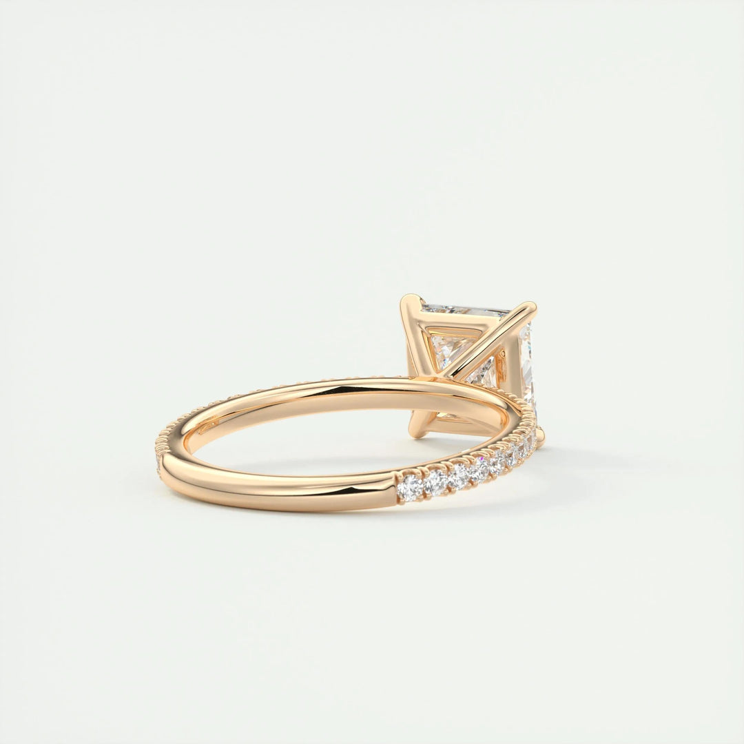 Macro shot of princess cut diamond facets in pave ring setting