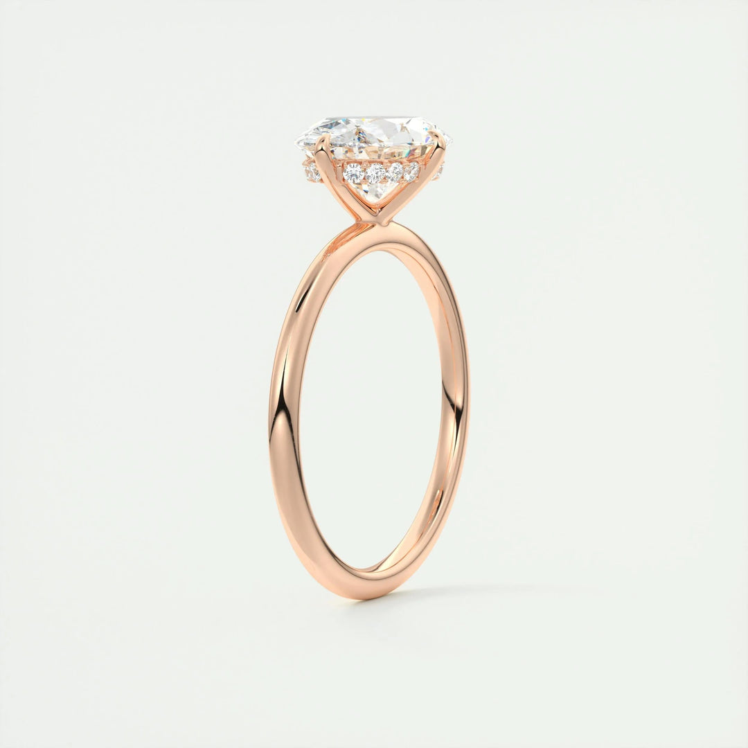 Oval hidden halo engagement ring close-up showing F-/VS1 diamond clarity