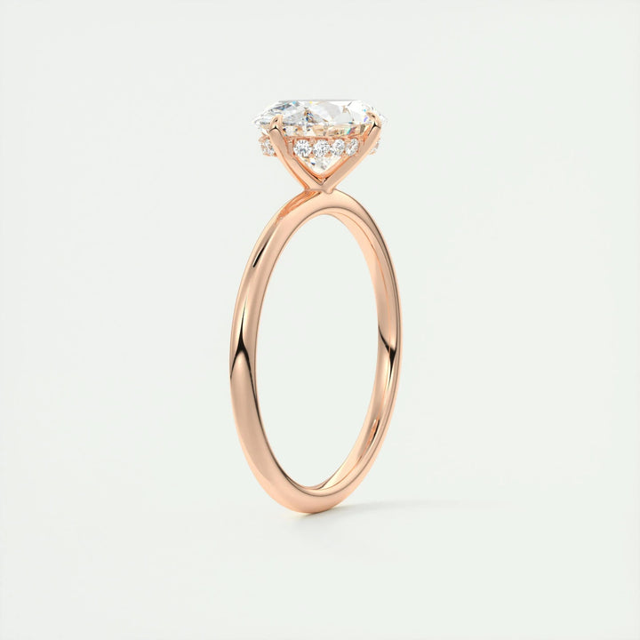 Oval hidden halo engagement ring close-up showing F-/VS1 diamond clarity