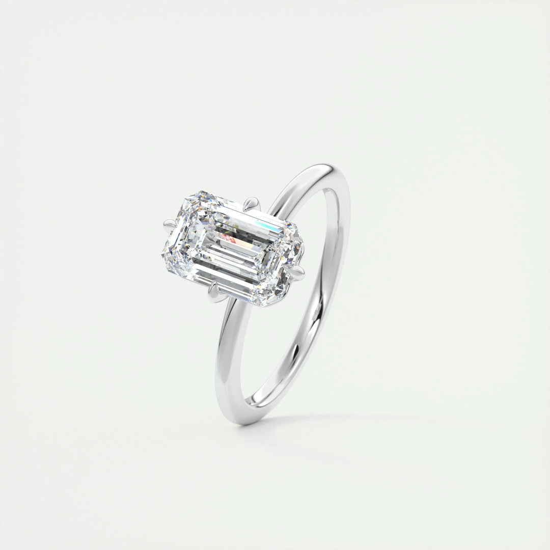 Fine craftsmanship detail on emerald solitaire engagement ring