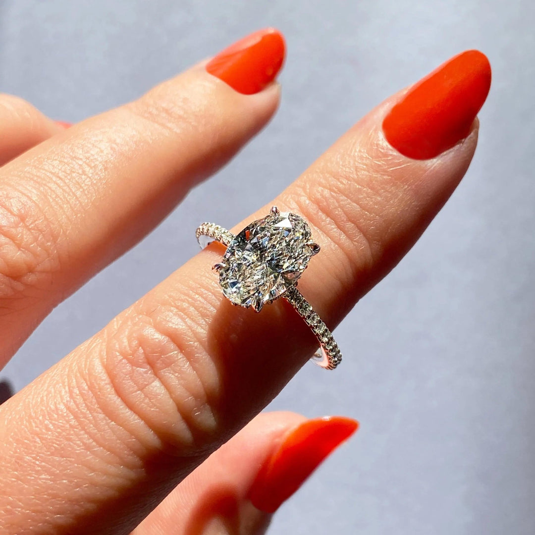 Oval pave engagement ring offered in gold and platinum