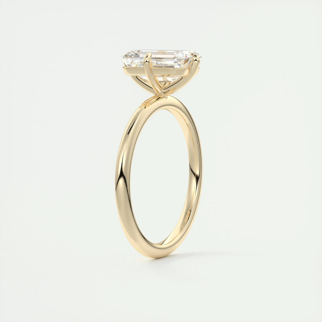Close-up of emerald cut center diamond in solitaire engagement ring