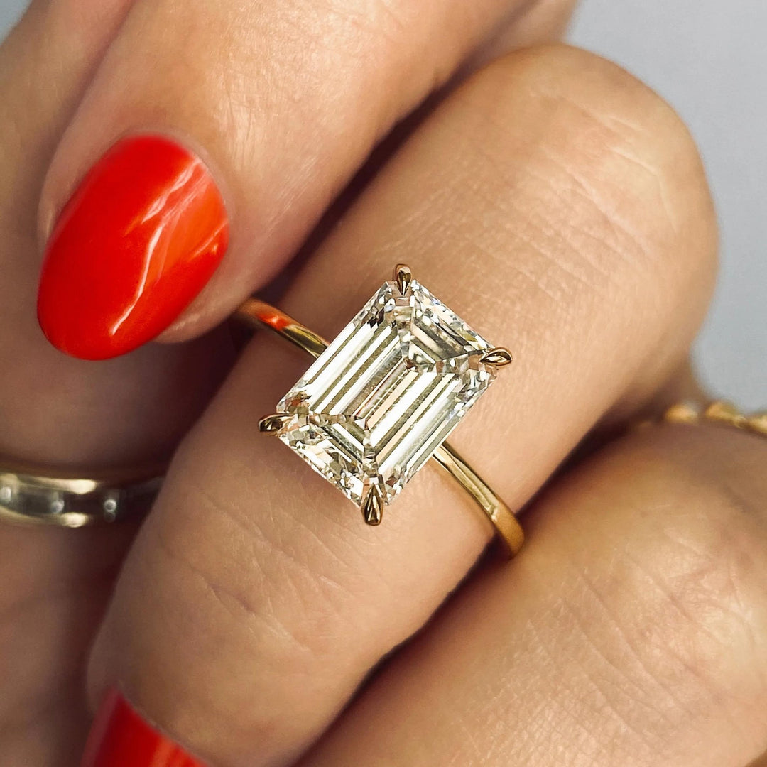 Emerald solitaire engagement ring with certified lab grown diamond