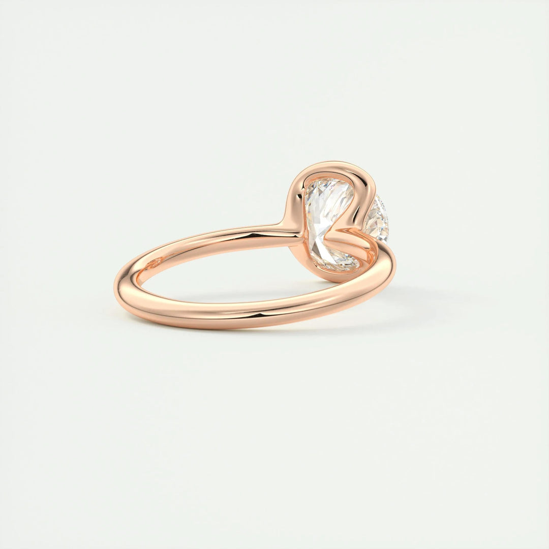Lifestyle shot of round solitaire diamond ring on hand