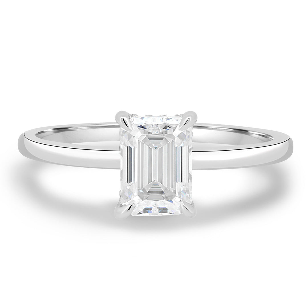 Emerald cut engagement ring shown with authenticity certificate