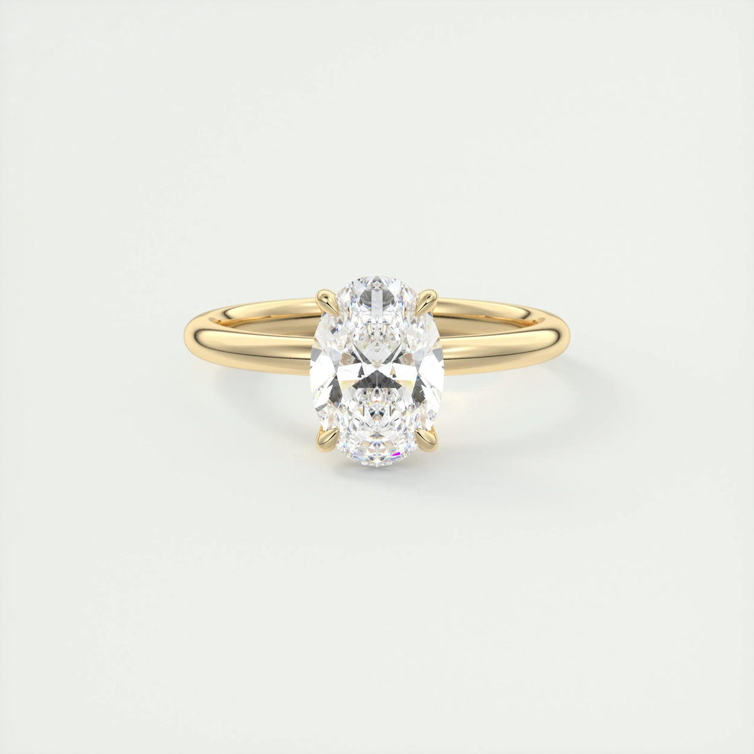 Lifestyle shot of oval solitaire diamond ring on hand