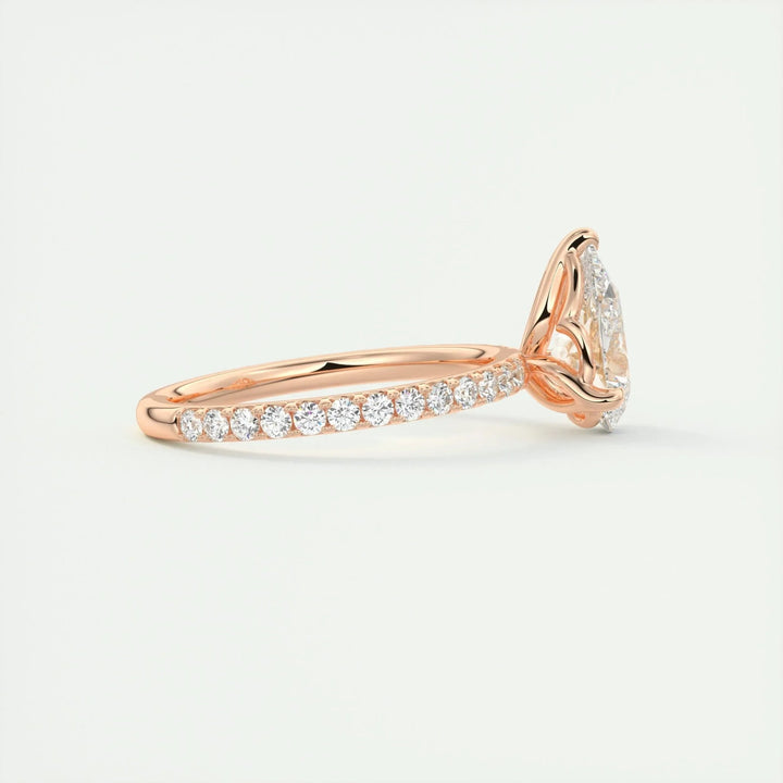 Pear pave engagement ring close-up showing F-/VS1 diamond clarity
