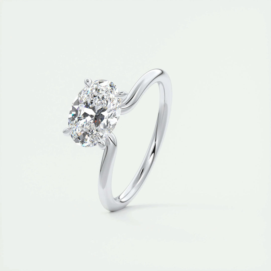 Oval east west engagement ring finished in polished solid gold