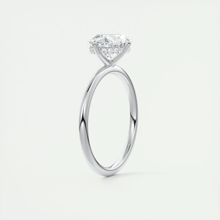 Oval cut engagement ring shown with authenticity certificate