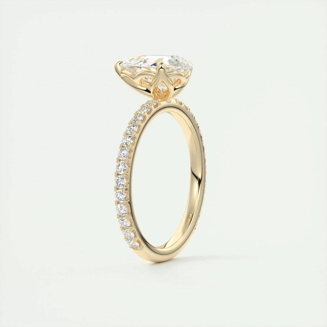 Top-down view of pear cut pave engagement ring