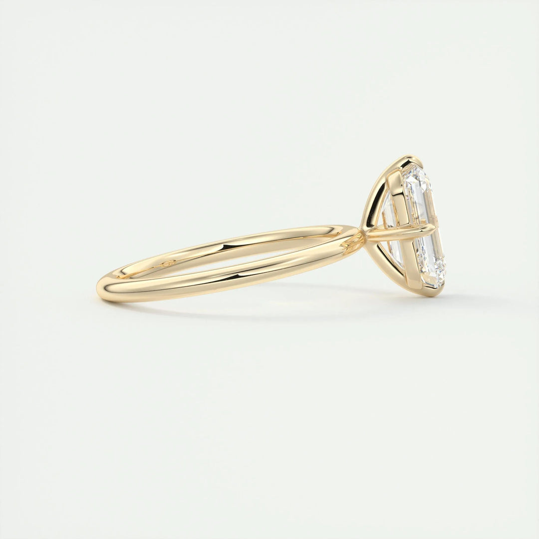Angled view of emerald cut diamond in solitaire setting
