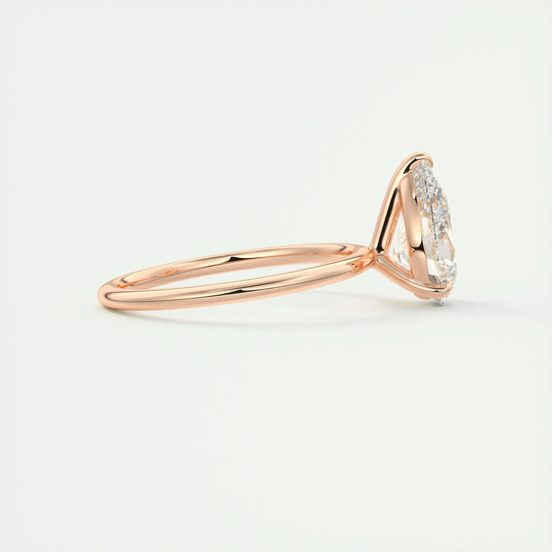 Lifestyle shot of pear solitaire diamond ring on hand