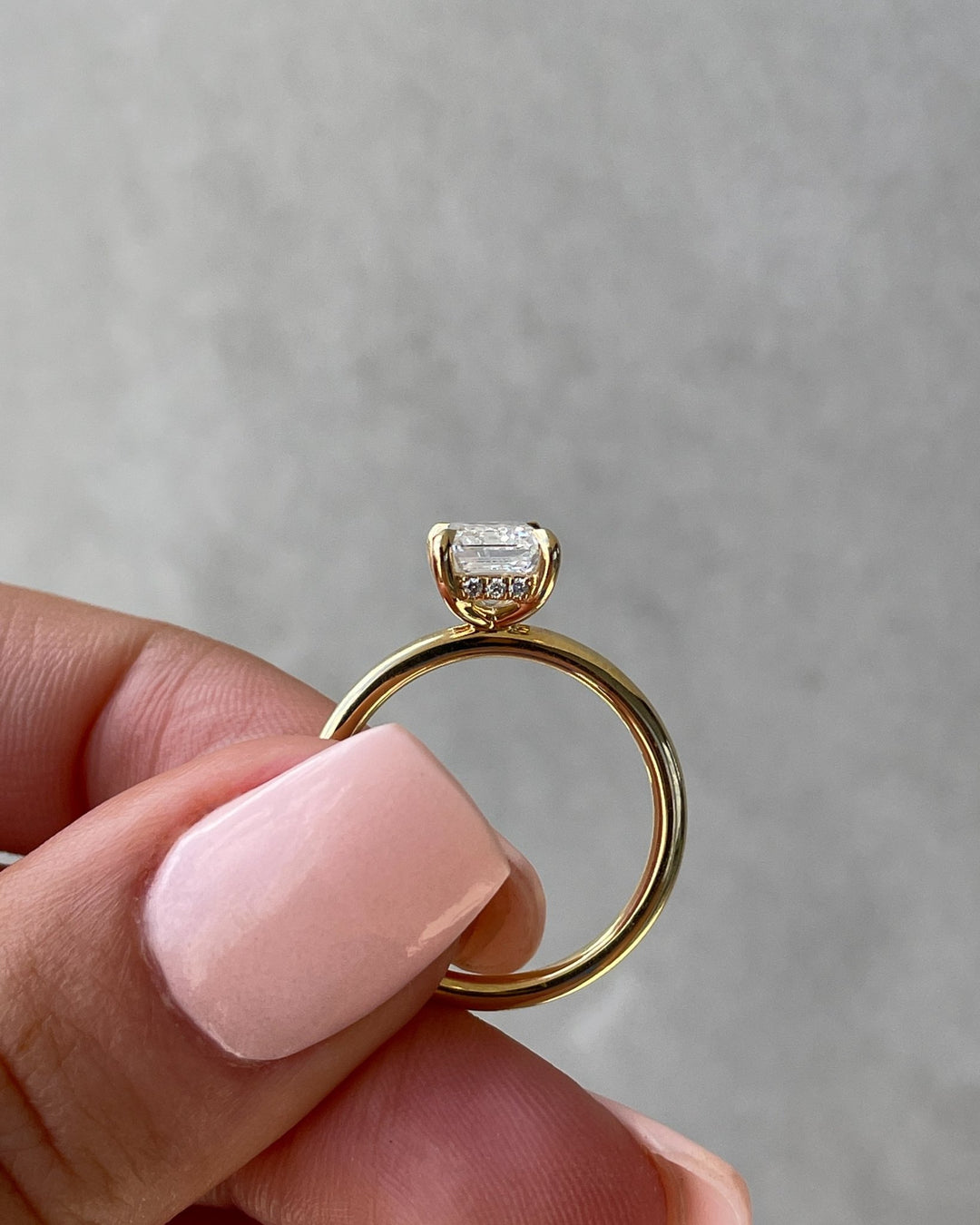 Handcrafted emerald cut hidden halo lab grown diamond engagement ring