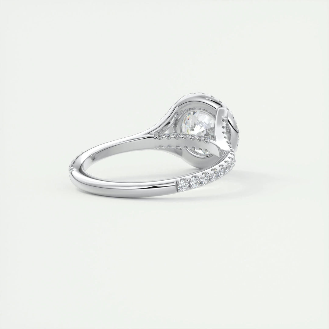 Round halo engagement ring finished in polished solid gold
