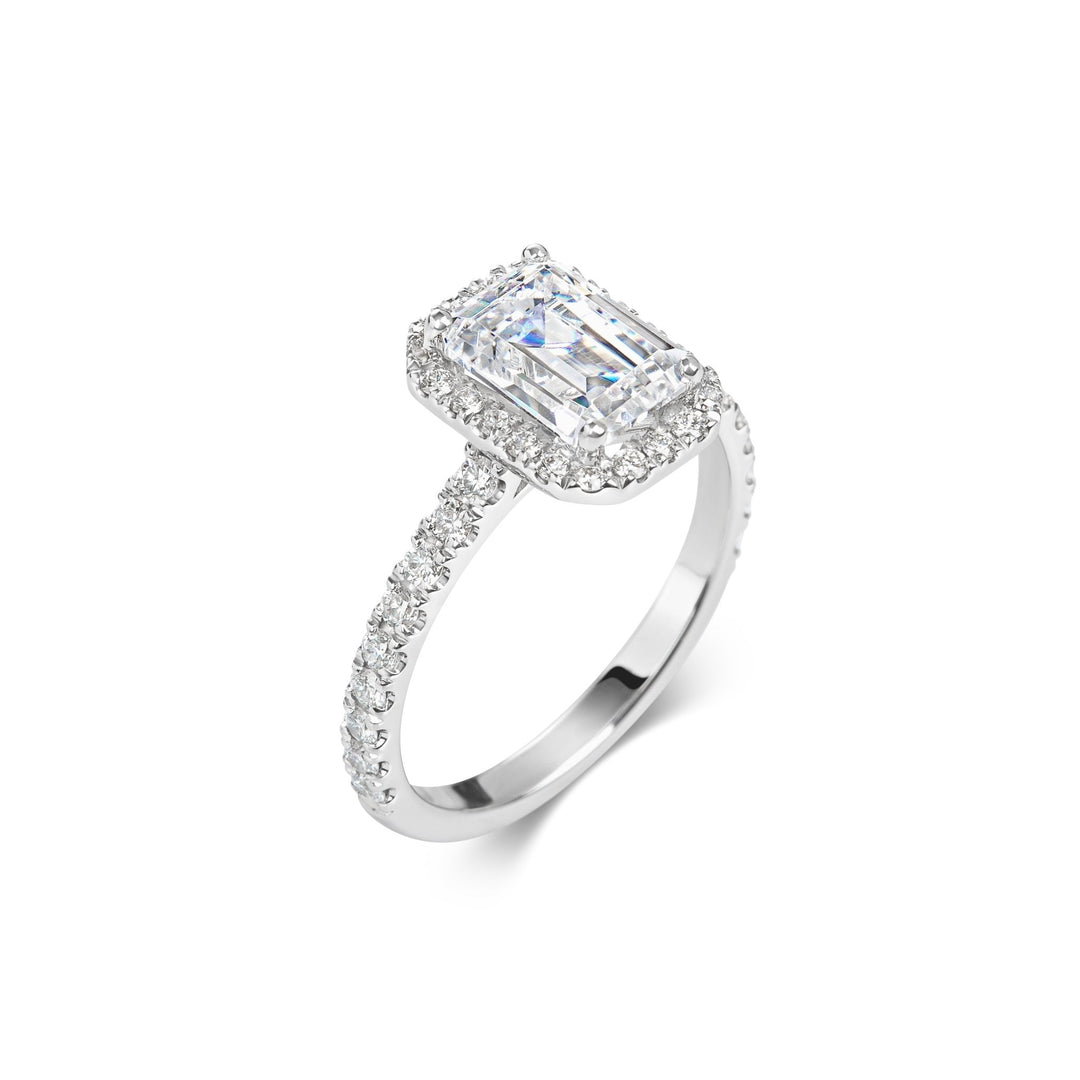 Emerald pave engagement ring shown on hand for true-to-life sizing