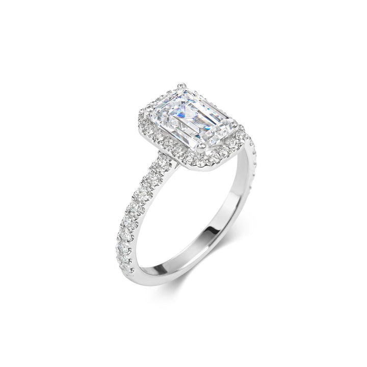 Emerald pave engagement ring shown on hand for true-to-life sizing