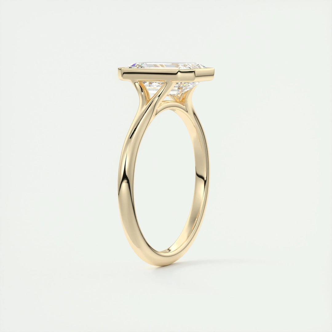IGI certified emerald cut diamond in bezel engagement ring setting