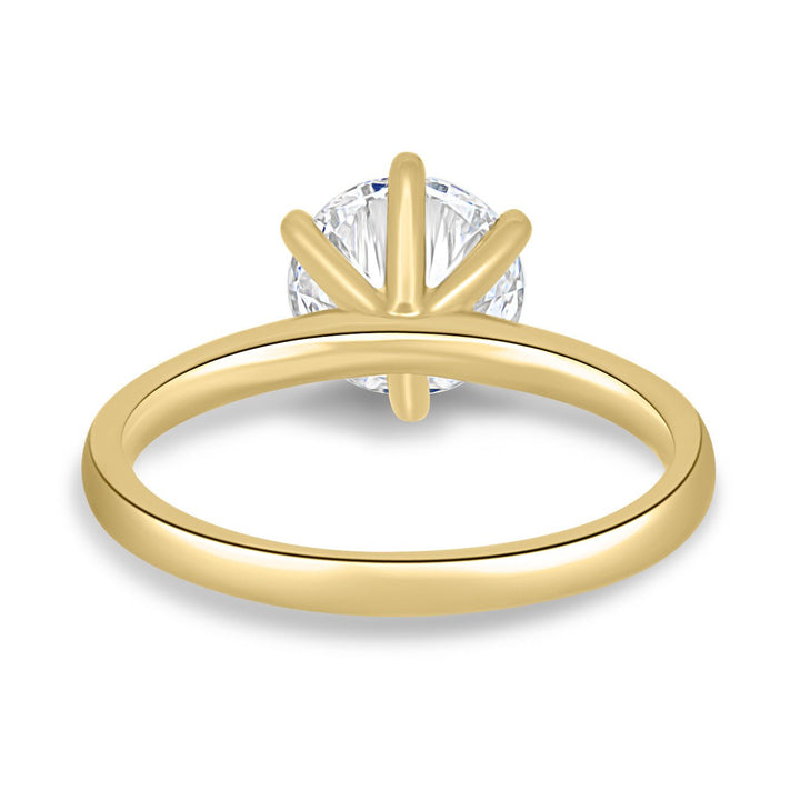 Round solitaire engagement ring offered in gold and platinum