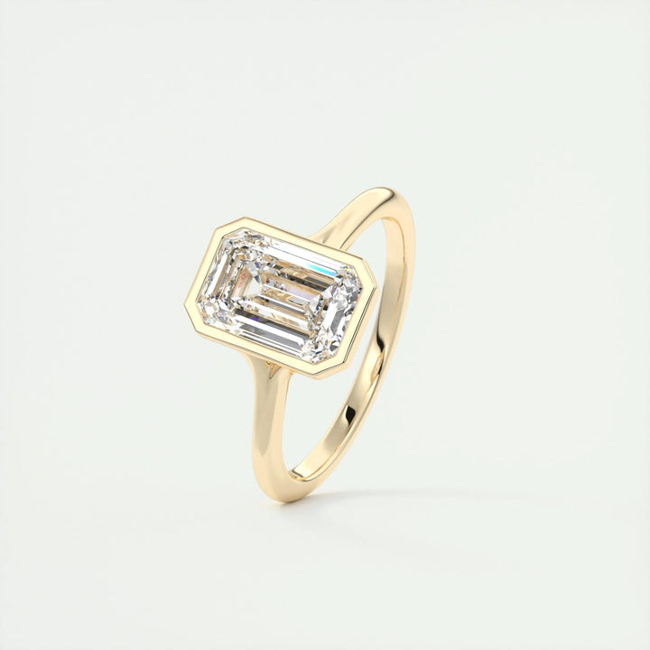 Lifestyle shot of emerald bezel diamond ring on hand