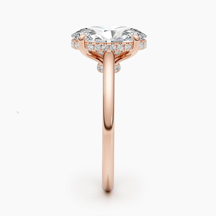 Oval hidden halo diamond ring displayed on jewelry stand