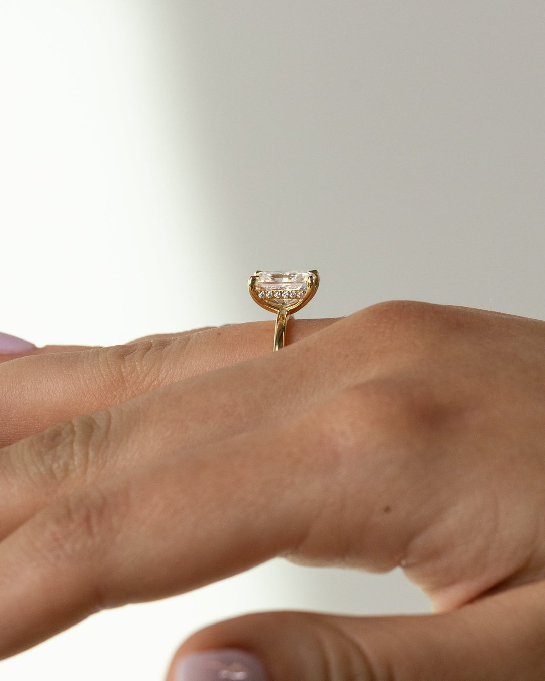 Emerald hidden halo diamond ring presented in signature gift packaging