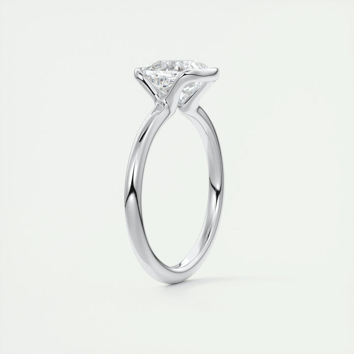 Cushion solitaire engagement ring finished in polished solid gold