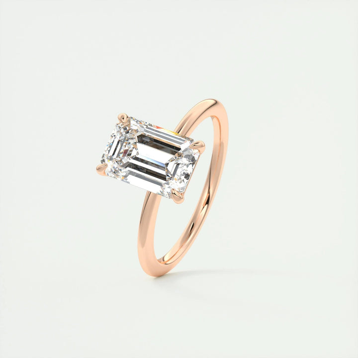 Emerald solitaire lab grown diamond ring fitted on finger