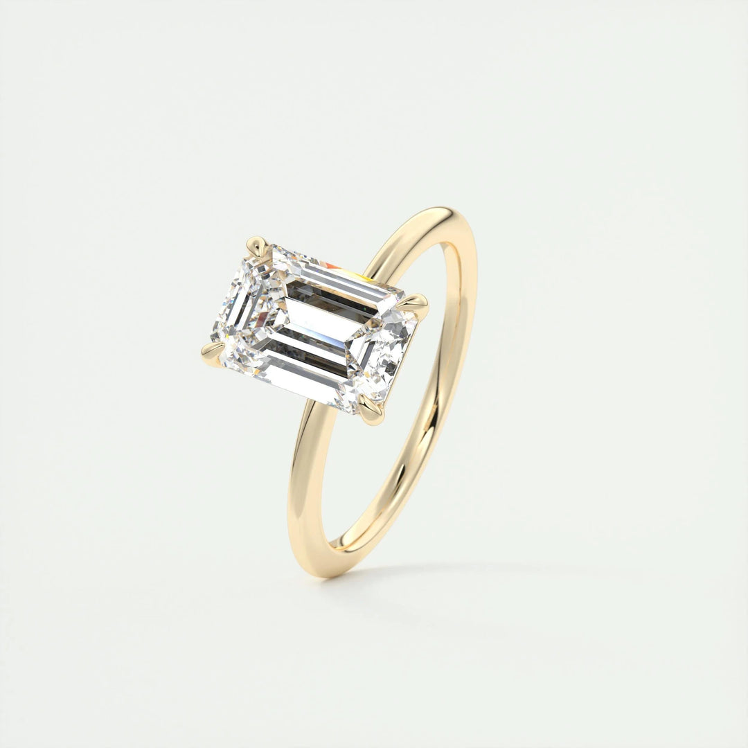 Emerald solitaire lab grown diamond ring side profile in gold setting
