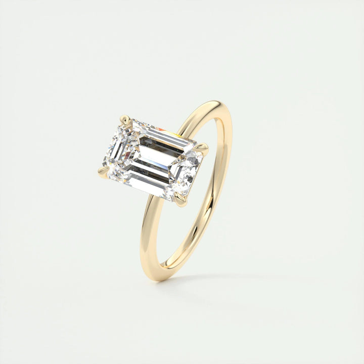 Emerald solitaire lab grown diamond ring side profile in gold setting