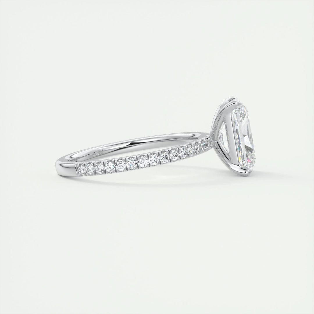 Angled view of radiant cut diamond in pave setting