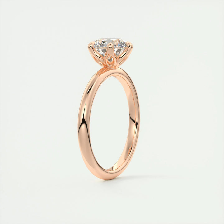 Lifestyle shot of round solitaire diamond ring on hand