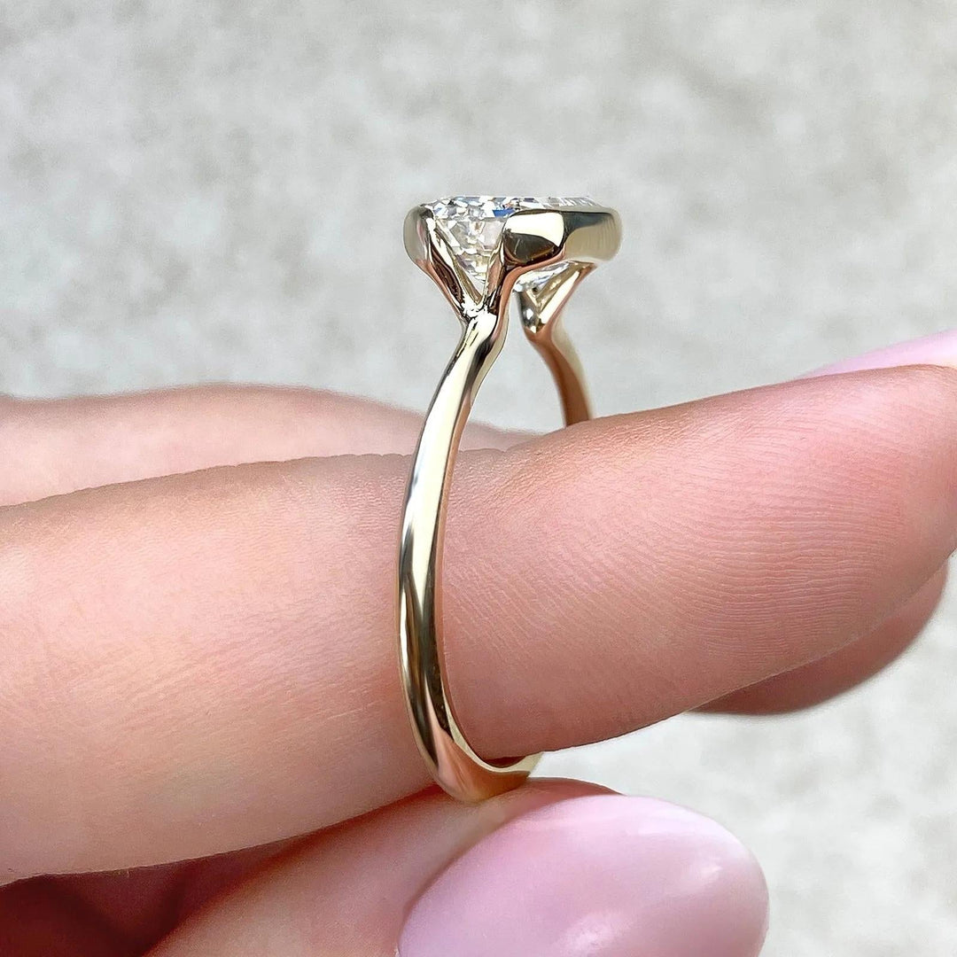 Emerald cut diamond ring worn on hand