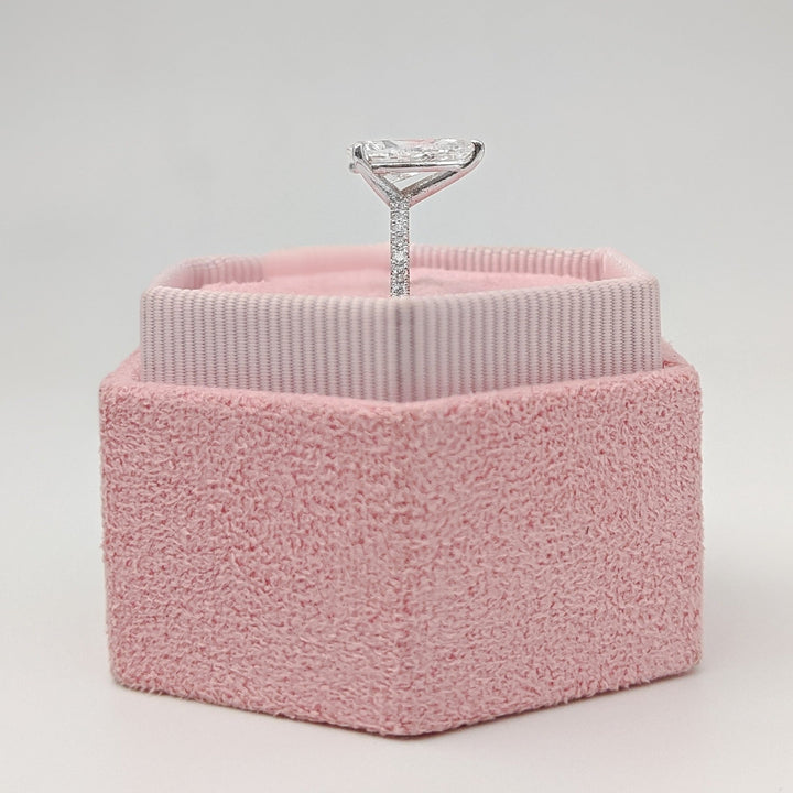 Profile view of pear cut pave engagement ring band