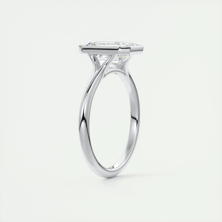 Emerald bezel engagement ring viewed from the side