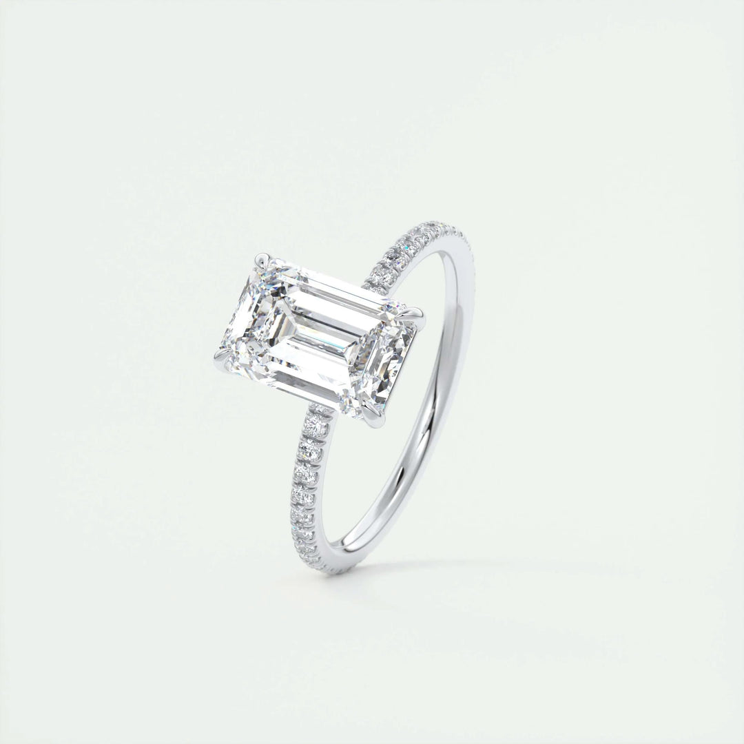 Unboxing view of emerald cut pave diamond engagement ring