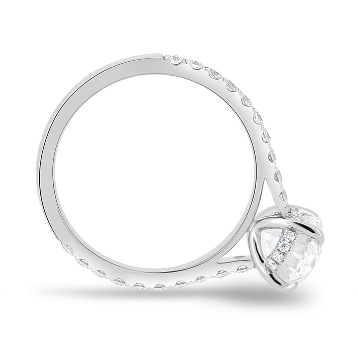 Angled view of oval cut diamond in hidden halo setting