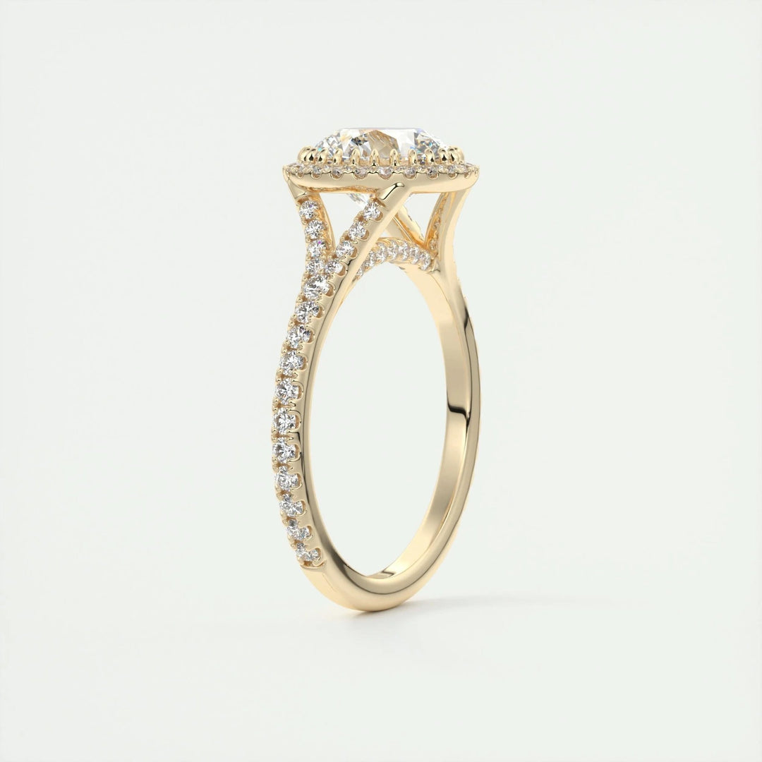 Close-up of round cut center diamond in halo engagement ring