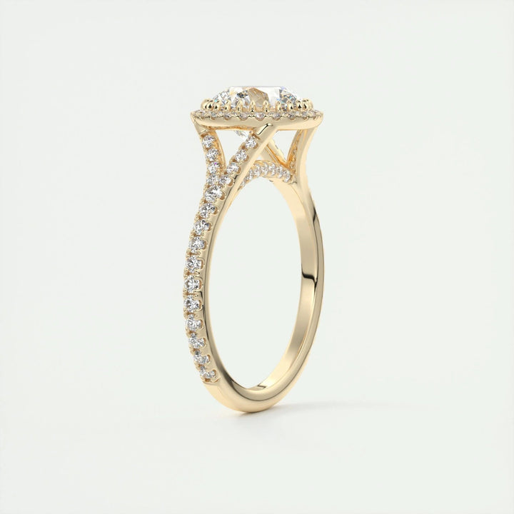 Close-up of round cut center diamond in halo engagement ring