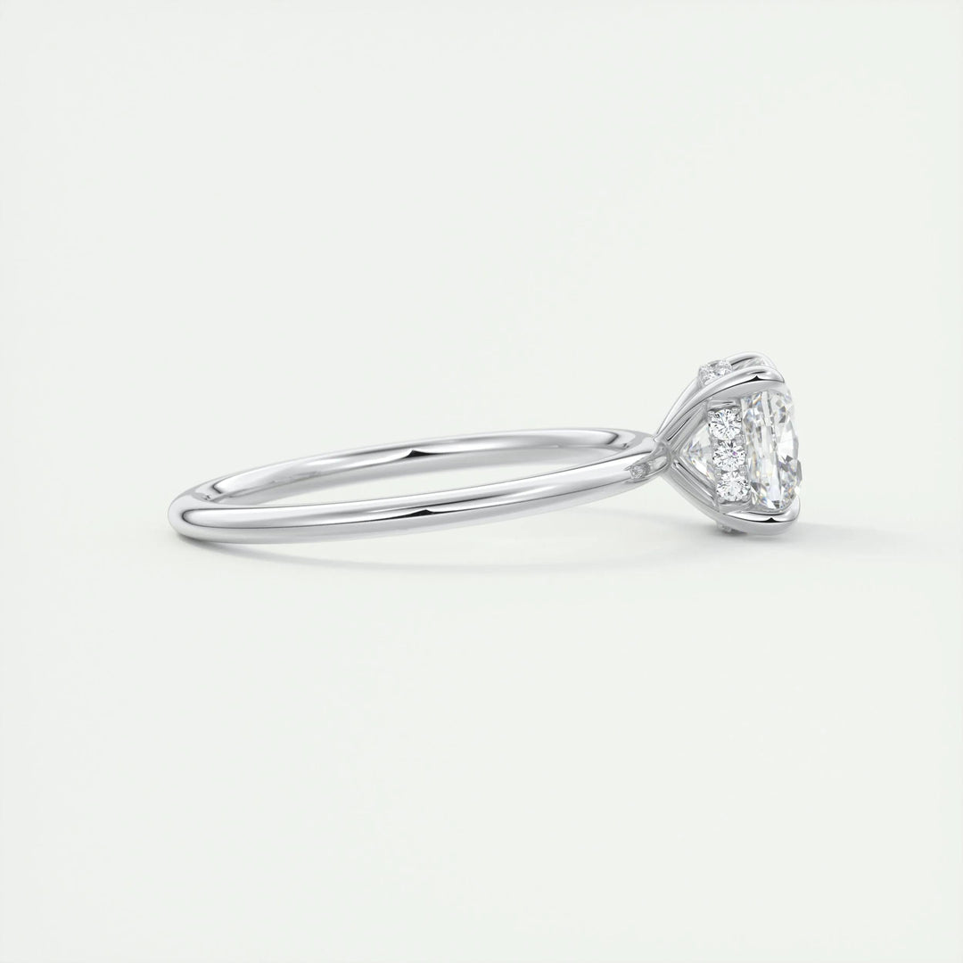 Cushion hidden halo engagement ring photographed in natural light