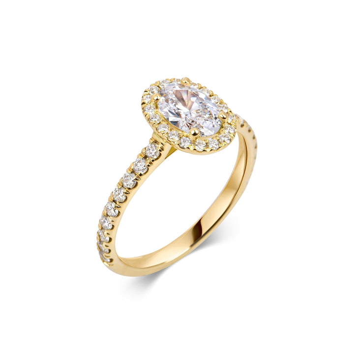 Oval pave engagement ring close-up showing F-/VS1 diamond clarity