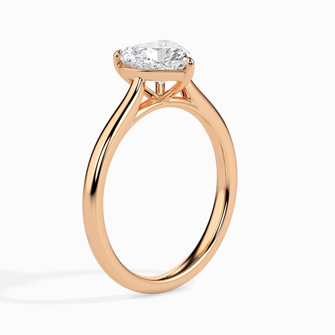 Heart solitaire engagement ring shown on hand for true-to-life sizing