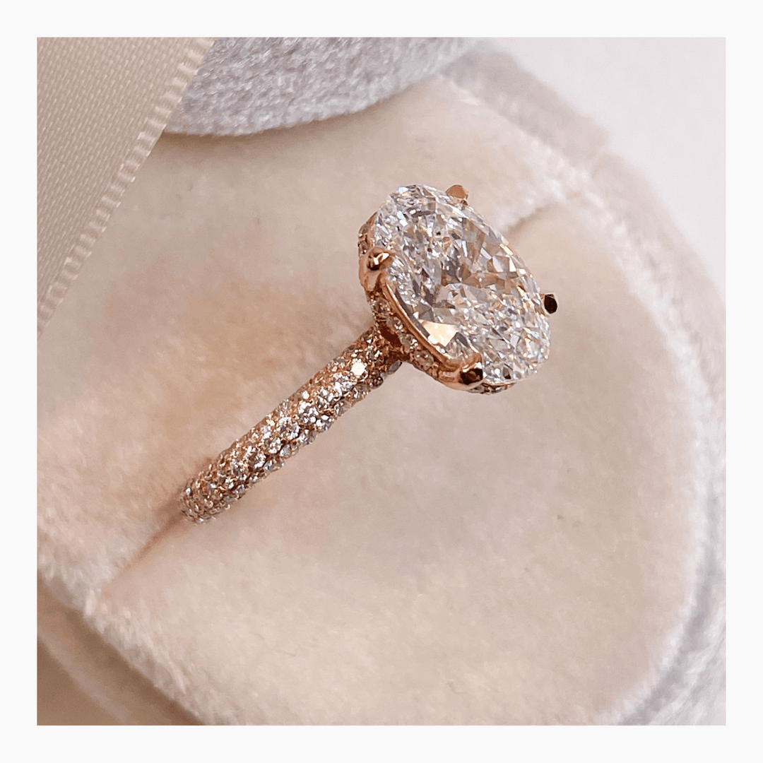 Fine craftsmanship detail on oval hidden halo engagement ring