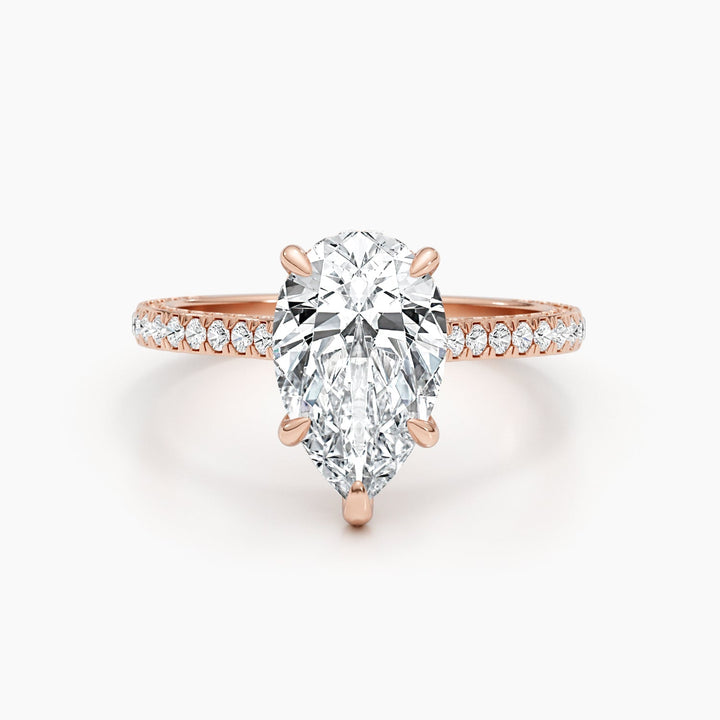 Profile view of pear cut hidden halo engagement ring band