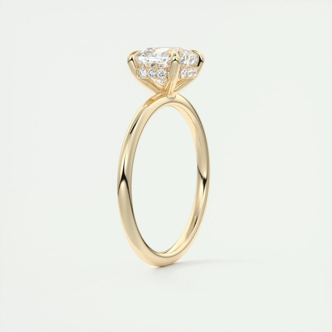 Cushion hidden halo engagement ring shown on hand for true-to-life sizing