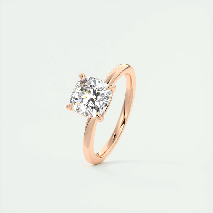 Cushion solitaire engagement ring finished in polished solid gold