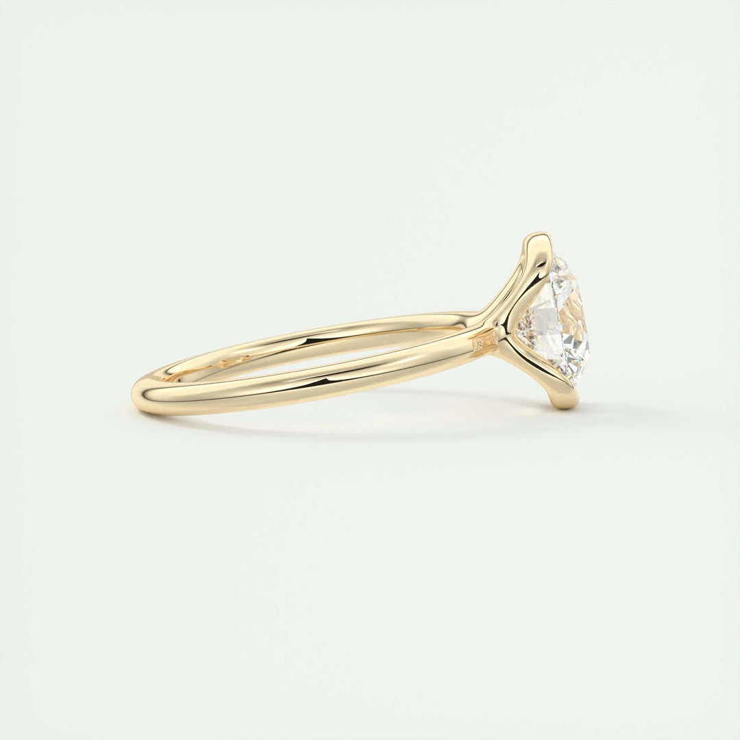 Side angle of round solitaire diamond engagement ring