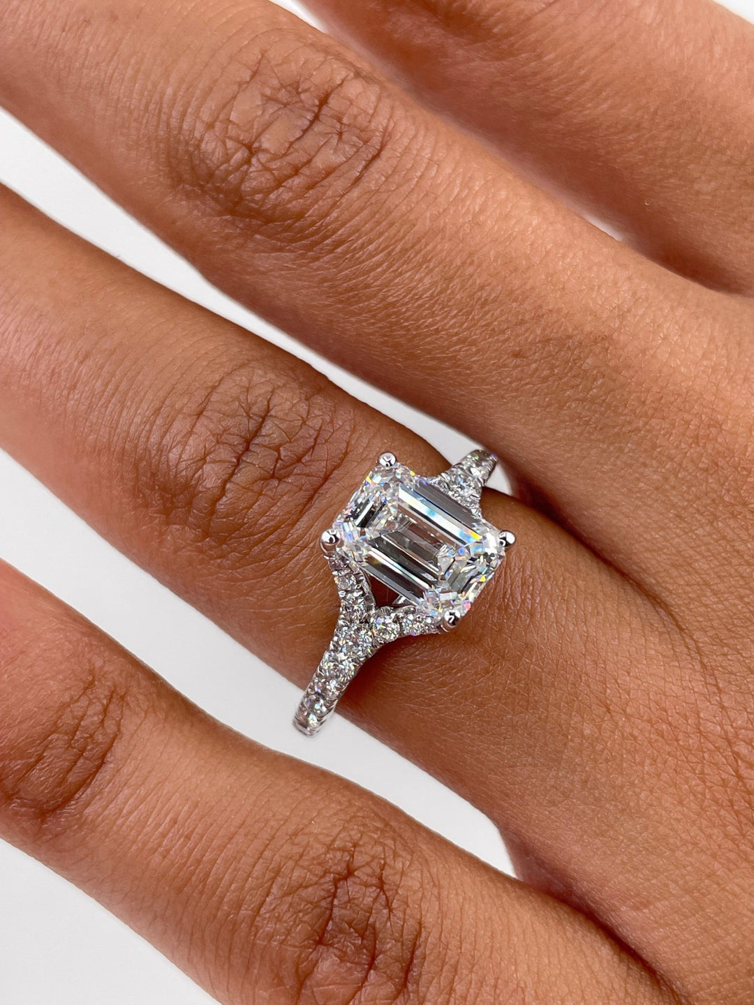 Emerald split shank lab grown diamond ring fitted on finger