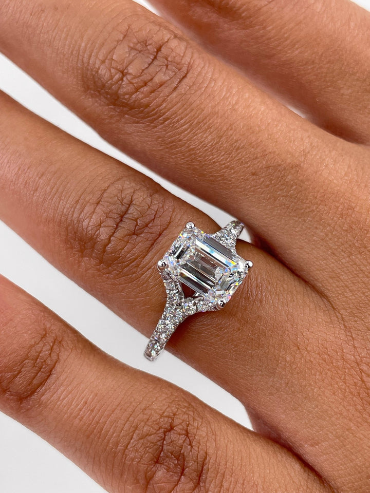 Emerald split shank lab grown diamond ring fitted on finger
