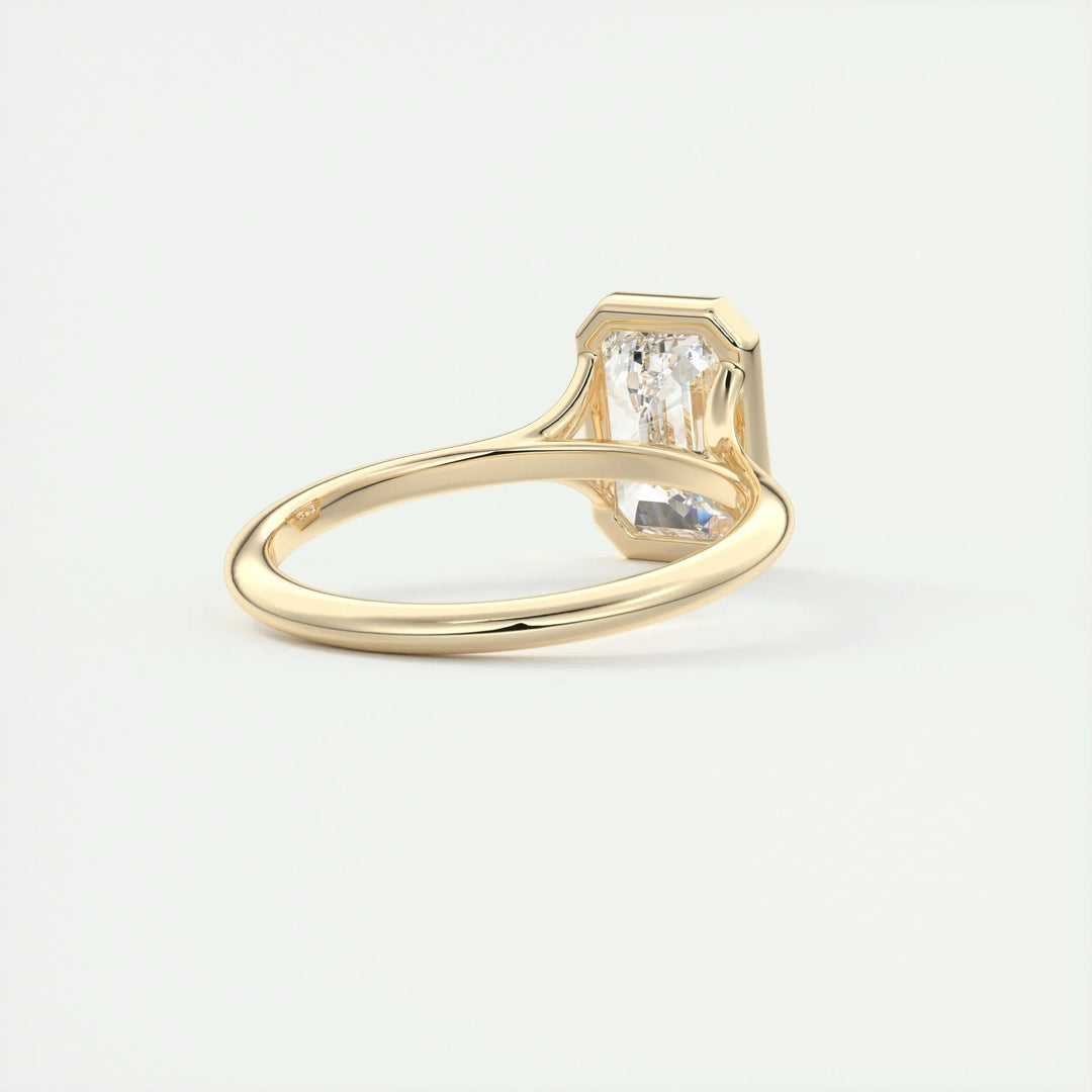 Emerald cut bezel engagement ring shown in real-life wear